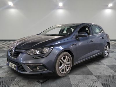 the blue car is parked on a checkered floor in the garage