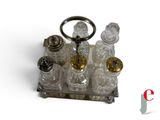 an image of a silver and glass perfume set