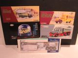 a box of assorted toy vehicles sitting on a table