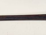 an image of a sword that is on a wall