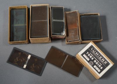 several boxes of different types of leather are sitting on a table