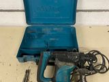 a close up of a blue tool box with tools on a table
