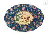 a blue plate with a picture of a man and a dog on it