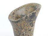 a small vase that is sitting on a white surface