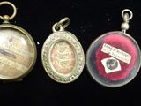 six different types of pendants are displayed on a black surface