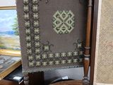 a picture of a picture of a cross stitch on a chair
