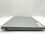 an open laptop computer sitting on top of a white table