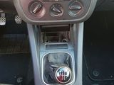 a picture of a car dashboard with a clock on it