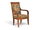 une image représentant une chaise en bois dont l'assise est recouverte d'un tissu coloré