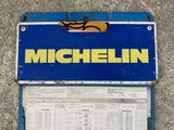 a sign that says michel on the side of the road