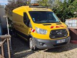 a yellow van that is parked next to a house