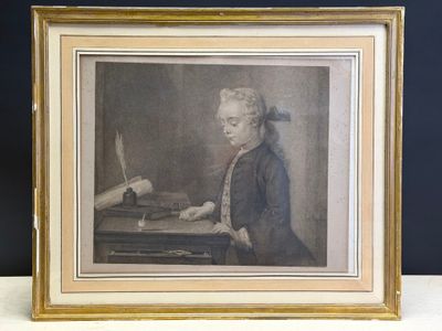 an old picture of a man sitting at a desk with a pen in his hand