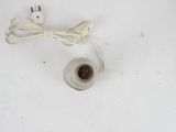 a cord that is connected to a plug on a white surface