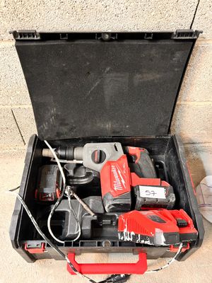a tool box with tools in it sitting on the floor