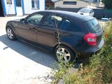 a black car parked on the side of the road