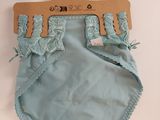blue baby bloomers with lace trims on a hanger on a white background