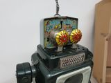 a toy robot that is sitting on top of a table