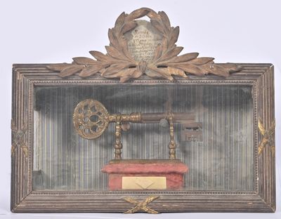 a picture of a clock and a key in a shadow box
