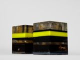 two black and yellow boxes sitting next to each other