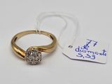 a gold ring with a diamond on it and a price tag