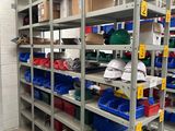 many shelves with bins on them in a warehouse
