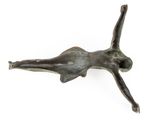 bronze figurine of a woman lying on her back