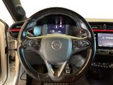 the interior of a car with a steering wheel and a touch screen