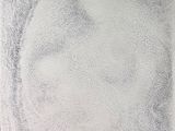 une image représentant le dessin du visage d'une personne sur une feuille de papier