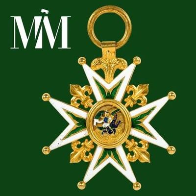 une image représentant une médaille dorée et blanche sur fond vert