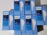 six boxes of philips led light bulbs sitting on top of a table