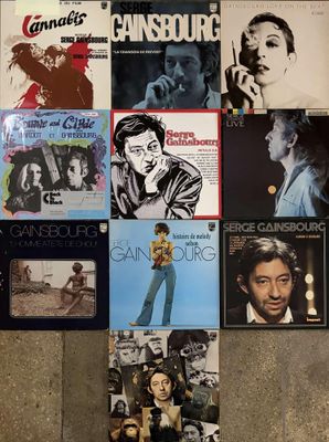 many different album covers on the floor of this room