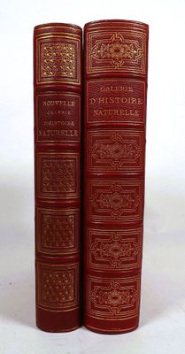 the two books are sitting side by side on a white surface