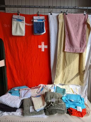 several towels hanging on a clothes line in a room