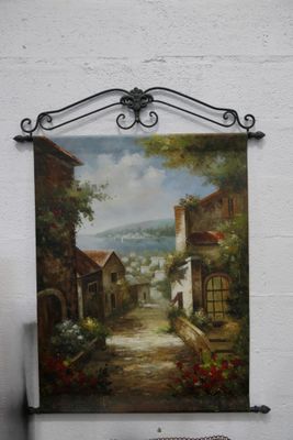 a painting hanging on the wall of a building