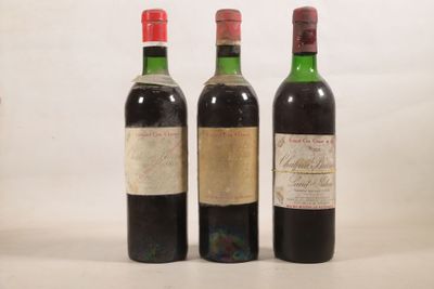 trois bouteilles de vin sont alignées sur une surface blanche