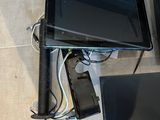 two laptops and a monitor on the floor
