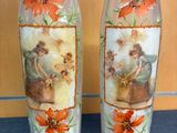 two vases that have pictures of people on them