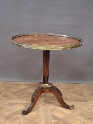 an image of a wooden table with a metal top on a wooden floor