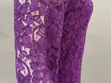 a close up of a woman wearing a purple lace dress