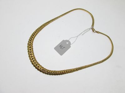 a close up of a gold chain with a price tag on it