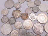 a lot of coins that are on the table
