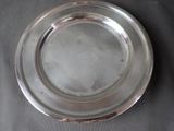 a silver plate that is sitting on a table