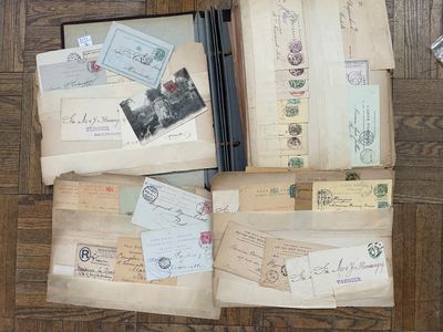 many old letters and envelopes sitting on the floor