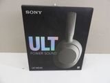 a box with a pair of headphones sitting on top of it