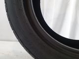 a close up of a tire on a white surface