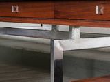 a wooden desk with two drawers on it