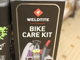 two cans of bike care kits on a shelf