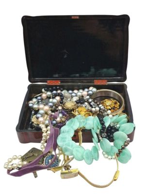 a black case with a bunch of jewelry inside of it