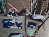 a cart with a bunch of items on it in a warehouse