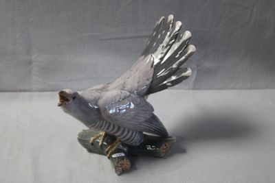 a bird that is sitting on top of a tree stump